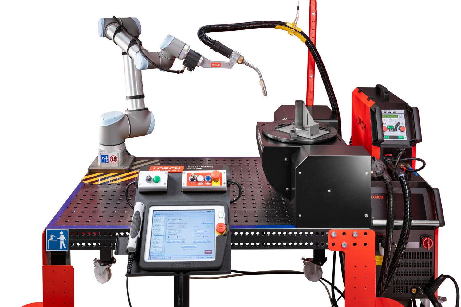 Automatisierter Schweißtisch mit einem kollaborativen Roboterarm, der eine Schweißpistole führt. Auf dem Tisch befinden sich ein Drehteller mit Metallteilen, ein Steuerpult mit Touchscreen und Bedienelementen sowie ein angeschlossenes Schweißgerät.
